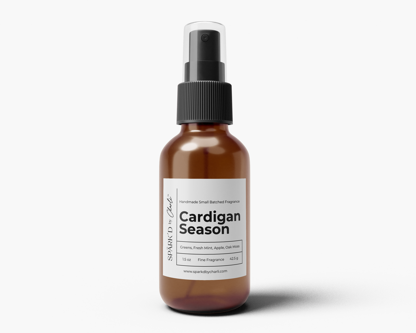 Brown spray bottle labeled 'Cardigan Season' on a white background